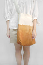 Load image into Gallery viewer, Model carry Eco friendly canvas bag with adjustable strap by Xiapism Natural Dye Sustainable Fashion