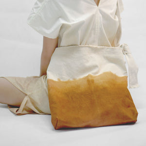 Model carry Eco friendly canvas bag with adjustable strap by Xiapism Natural Dye Sustainable Fashion