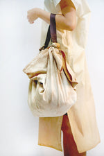 Load image into Gallery viewer, A piece of Furoshiki + a Stripe = Furoshiki Handbag. Sustainable fashion, stylish. the furoshiki is reversable. By Xiapism Natural Dye Sustainable Fashion
