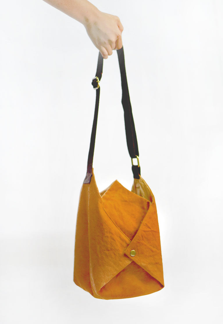 A fun design sling bag with 4 inner pockets for ease of use by Xiapism Natural Dye Sustainable Fashion