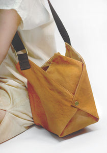 A fun design sling bag with 4 inner pockets for ease of use by Xiapism Natural Dye Sustainable Fashion